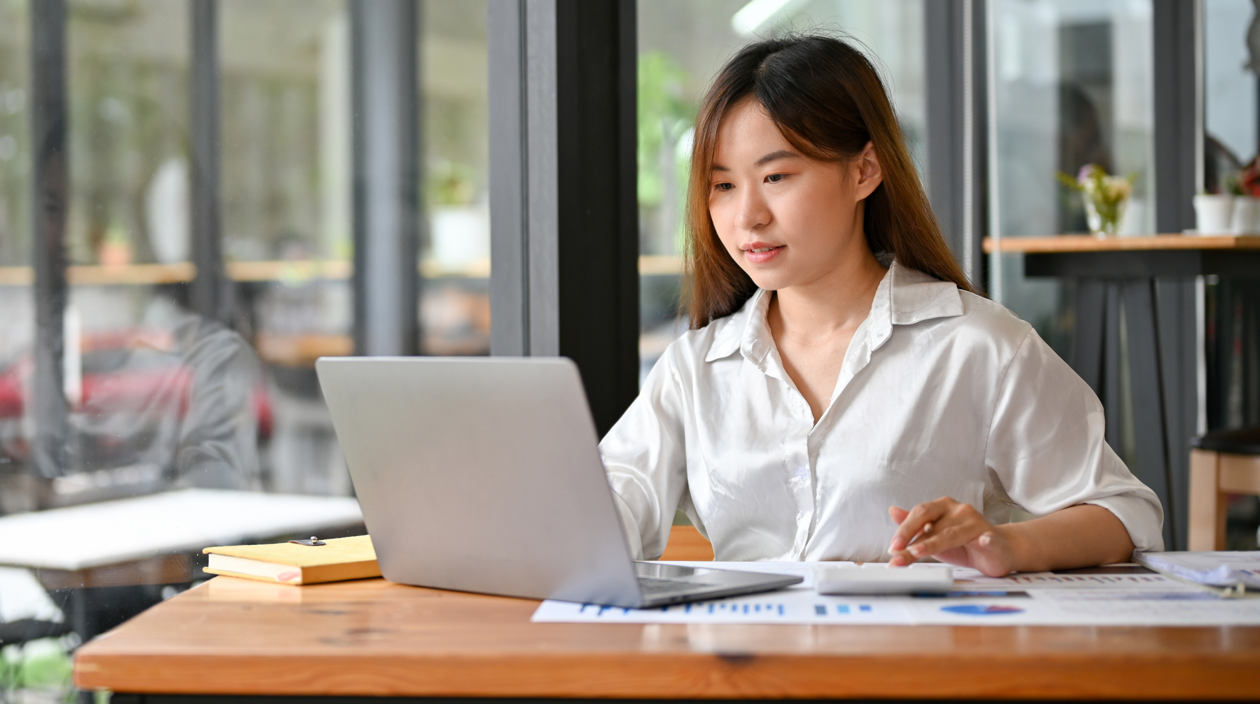data analyst looking at her computer