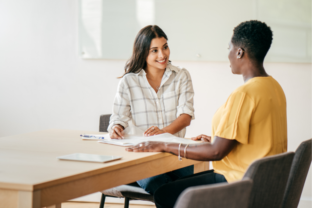 two women discussing something business related