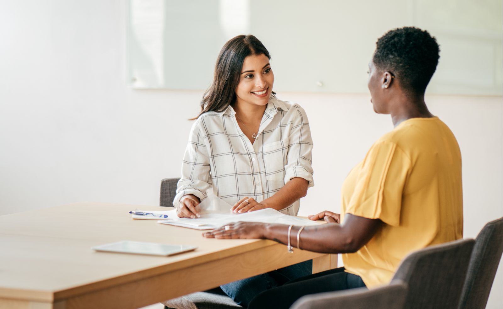 two women discussing something business related